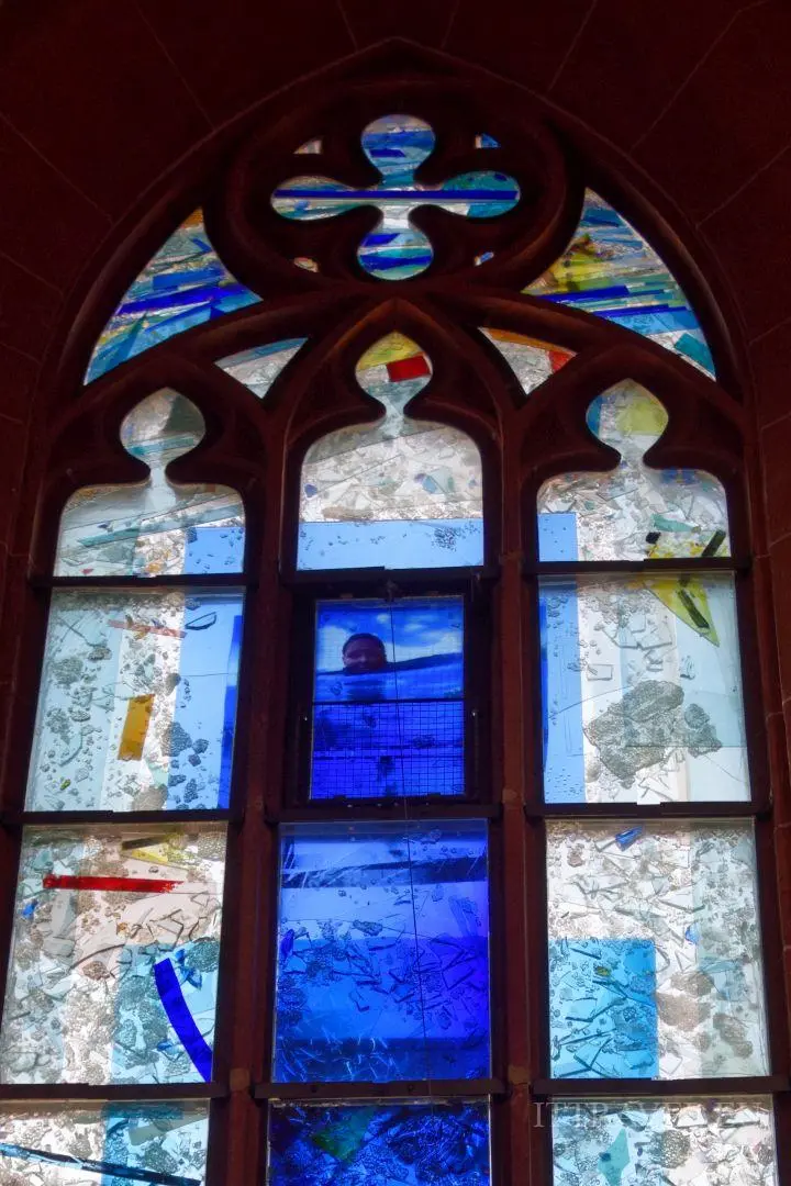 and also by unusual stained-glass windows. Is some guy swimming there?!