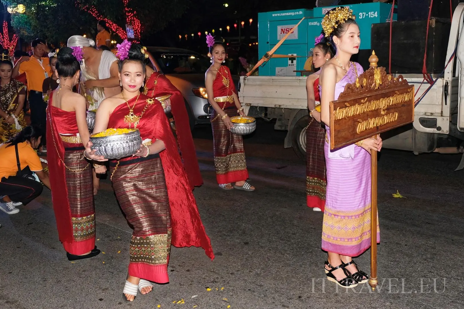 Thai girls awaiting the start of the parade were very willing to pose for photos