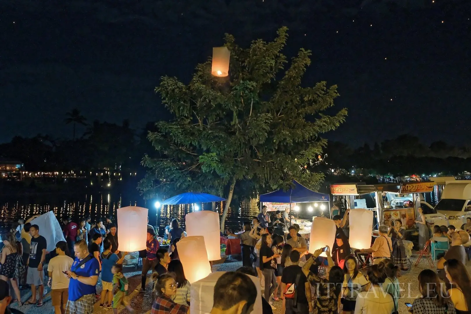 Moments along the river were crowds releasing lanterns